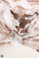 A close up of a man's face covered in milk.