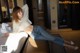 A woman laying on a bed in a hotel room.