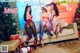 A group of women sitting on top of a couch next to a Christmas tree.