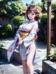 A woman in a kimono standing in front of a building.