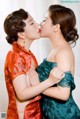 A couple of women that are kissing each other.