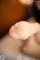 A close up of a person's foot with a string attached to it.