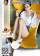 a japanese woman sitting on top of a yellow chair