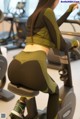 A woman riding a stationary bike in a gym.