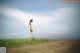 A woman standing in a field with the word SMART written on it.