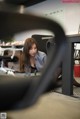 A woman sitting at a desk in an office.