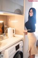 A woman standing next to a washing machine in a kitchen.